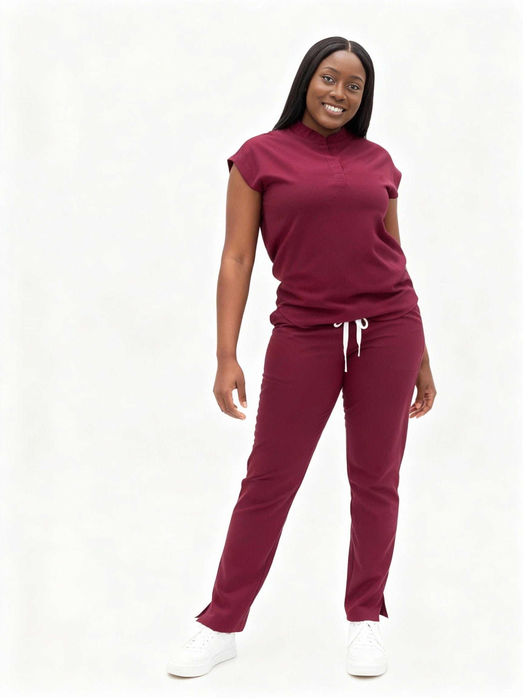 Happy black woman wearing Snatch Eleven Wine Scrub Set